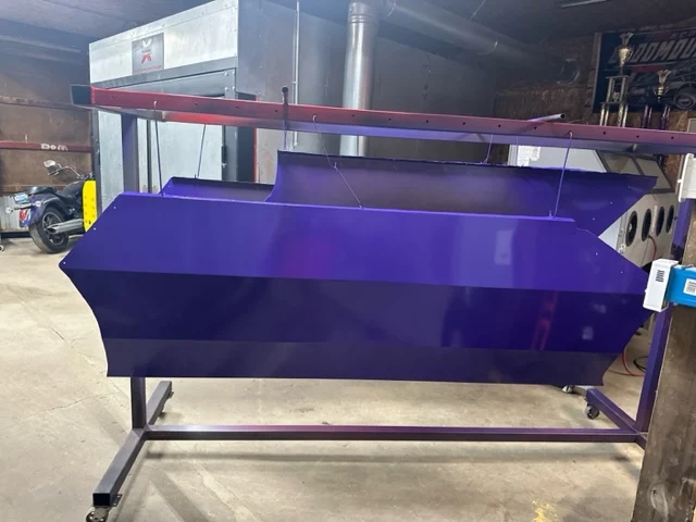 Plow blade powder-coated in glossy candy purple